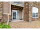 Exterior of building with a stone facade and gravel landscaping at 7440 S Blackhawk St # 2-108, Englewood, CO 80112