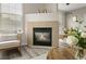 Charming fireplace area with a cozy armchair, creating a warm and inviting atmosphere at 7440 S Blackhawk St # 2-108, Englewood, CO 80112