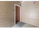 Exterior shot of a condo front door with a brown finish and apartment number 108 at 7440 S Blackhawk St # 2-108, Englewood, CO 80112