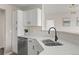 Well-lit kitchen featuring stainless steel appliances, white cabinets, and a modern aesthetic at 7440 S Blackhawk St # 2-108, Englewood, CO 80112