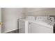 Laundry room with a shelf and side-by-side white washer and dryer appliances at 7440 S Blackhawk St # 2-108, Englewood, CO 80112