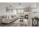 Bright living room featuring a fireplace and large window to provide lots of natural light at 7440 S Blackhawk St # 2-108, Englewood, CO 80112