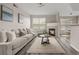 Cozy living room showcasing a plush couch, fireplace, and an inviting view to the dining area at 7440 S Blackhawk St # 2-108, Englewood, CO 80112