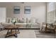 Inviting living room features a comfortable sofa, stylish decor, and plenty of natural light at 7440 S Blackhawk St # 2-108, Englewood, CO 80112