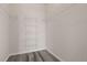 Walk-in closet with adjustable shelving and gray floors offers storage space at 7440 S Blackhawk St # 2-108, Englewood, CO 80112
