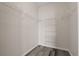 A walk-in closet with gray floors and white, adjustable shelving provides plenty of storage space at 7440 S Blackhawk St # 2-108, Englewood, CO 80112