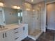 Contemporary bathroom with walk-in shower and vanity at 5021 S Prince Pl, Littleton, CO 80123