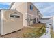 Backyard view of home with storage shed and fence at 19813 E 47Th Ave, Denver, CO 80249