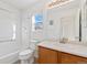 Clean bathroom with a shower/tub combo and wooden vanity at 19813 E 47Th Ave, Denver, CO 80249