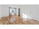 Hardwood floor bedroom with access to bathroom and closet at 19813 E 47Th Ave, Denver, CO 80249