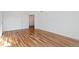 Bright bedroom with hardwood floors and access to hallway at 19813 E 47Th Ave, Denver, CO 80249