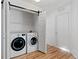 Laundry room with washer, dryer, and built-in shelving at 19813 E 47Th Ave, Denver, CO 80249