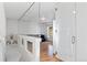 Upstairs hallway with glass partition and hardwood floors at 19813 E 47Th Ave, Denver, CO 80249