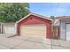 Garage with a light yellow door; there is another garage to the left, and a door with wooden fencing to the right at 1356 N Marion St, Denver, CO 80218
