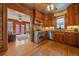 Well-lit kitchen featuring stainless steel appliances, stainless steel backsplash, and beautiful wood cabinets at 1356 N Marion St, Denver, CO 80218