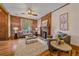 Inviting living room with exposed brick fireplace, hardwood floors, and stylish seating arrangement at 1356 N Marion St, Denver, CO 80218