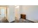 Spacious bedroom with neutral carpet and natural light, offering a peaceful and adaptable living space for relaxation and personalization at 12935 W 64Th Dr # D, Arvada, CO 80004