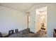 Bright bedroom featuring neutral carpet, vaulted ceilings, and an ensuite bathroom, creating a comfortable and private retreat at 12935 W 64Th Dr # D, Arvada, CO 80004