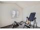 Minimalist bedroom with carpet flooring and natural light, featuring gym equipment for convenient at-home fitness at 12935 W 64Th Dr # D, Arvada, CO 80004