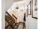 Bright entryway featuring a staircase, neutral walls, and stylish decor at 12935 W 64Th Dr # D, Arvada, CO 80004
