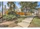 View of the rear of the house with a fenced backyard and walkway at 12935 W 64Th Dr # D, Arvada, CO 80004