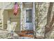 Close up of the front door, shows house number and the American flag at 12935 W 64Th Dr # D, Arvada, CO 80004