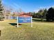 Yankee Doodle Park sign with a view of the park and a lake in the background, inviting outdoor recreation at 12935 W 64Th Dr # D, Arvada, CO 80004