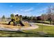 Community playground and pond in lush neighborhood park at 12935 W 64Th Dr # D, Arvada, CO 80004