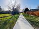 Scenic walking path, surrounded by greenery and a wooden fence along the community border at 12935 W 64Th Dr # D, Arvada, CO 80004