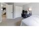 Neutral carpeted bedroom featuring a closet and adjacent staircase at 4715 E 127Th Dr, Thornton, CO 80241