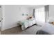 Bright bedroom features two twin beds with a large window bringing in natural light at 4715 E 127Th Dr, Thornton, CO 80241