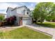 Attractive two-story home boasting a manicured lawn and a two car garage at 4715 E 127Th Dr, Thornton, CO 80241