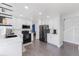 Bright kitchen features modern appliances, white cabinets, and plenty of natural light at 4715 E 127Th Dr, Thornton, CO 80241