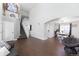 Inviting living room featuring hardwood floors, high ceilings, and a staircase leading to the upper level at 4715 E 127Th Dr, Thornton, CO 80241