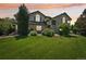 Gorgeous multi-level home with a lush lawn and mature landscaping at 8653 E Dry Creek Rd # 1121, Englewood, CO 80112