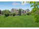 Multi-level home featuring well-maintained landscaping at 8653 E Dry Creek Rd # 1121, Englewood, CO 80112