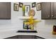Close up of the kitchen sink and countertop with stylish decor accents at 8653 E Dry Creek Rd # 1121, Englewood, CO 80112