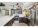 Modern kitchen with stainless steel appliances, sleek countertops, and ample cabinet space at 8653 E Dry Creek Rd # 1121, Englewood, CO 80112