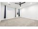 Spacious carpet-free bedroom with ample natural light and city views through large windows at 303 Rogers Ct, Castle Rock, CO 80104