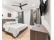 Cozy bedroom with natural light, a modern ceiling fan, and stylish decor for relaxation at 303 Rogers Ct, Castle Rock, CO 80104