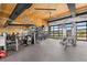 Well-equipped gym with various exercise machines, weights, and a mirrored wall, offering a comprehensive fitness experience at 303 Rogers Ct, Castle Rock, CO 80104