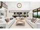 Expansive living area showcasing open floor plan with fireplace, kitchen and dining area at 303 Rogers Ct, Castle Rock, CO 80104