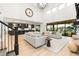 Open-concept living space with a kitchen, living room, and staircase, perfect for entertaining at 303 Rogers Ct, Castle Rock, CO 80104