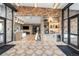 Welcoming lobby with stone accent walls, modern flooring, a coffee bar, and stylish lighting for a sophisticated entrance at 303 Rogers Ct, Castle Rock, CO 80104
