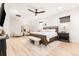 Bright bedroom with white accents, modern furniture, and a spacious area for relaxing at 303 Rogers Ct, Castle Rock, CO 80104