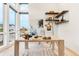 Contemporary home office with natural light, decorative shelves, and modern decor at 303 Rogers Ct, Castle Rock, CO 80104