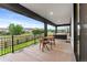Outdoor patio with dining table and chairs overlooking backyard at 303 Rogers Ct, Castle Rock, CO 80104