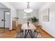 Dining room with modern lighting, table, and natural light from the large window at 6769 S Foresthill St, Littleton, CO 80120
