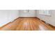 Spacious living room with hardwood floors and a large window providing natural light at 6769 S Foresthill St, Littleton, CO 80120