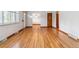 Bright living room with hardwood floors and a doorway leading to the dining area at 6769 S Foresthill St, Littleton, CO 80120